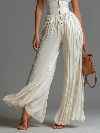 Vittoria | Tuta nera in chiffon con scollo a V, senza maniche, con zip, a pieghe, pantaloni a palazzo