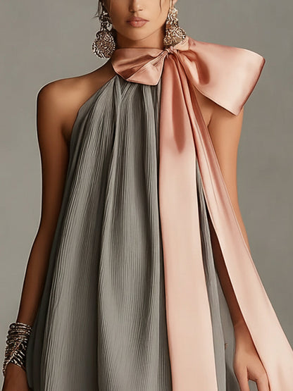Natalia | Vestido mini gris de satén con cuello halter, lazo y ribete de encaje