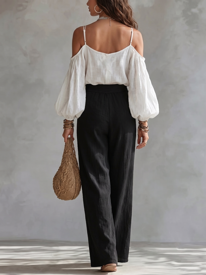Nicoletta | Completo con top bianco a spalle scoperte e pantaloni neri a palazzo
